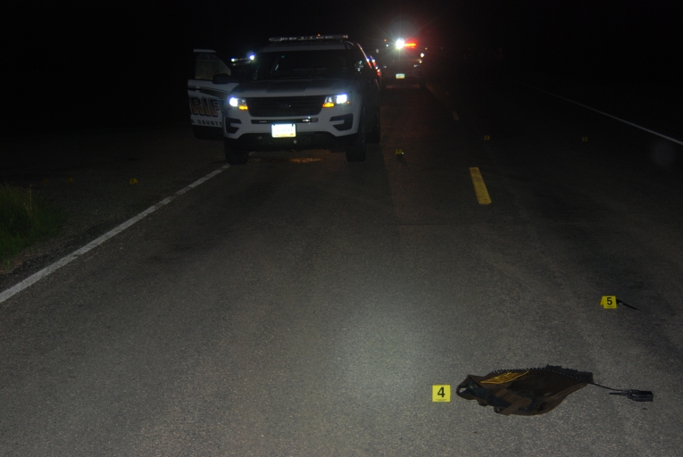 Bowman/Monteith police shooting scene. Deputy Brad Bowman told BCI he shot Monteith inside the police vehicle because Monteith had a knife. Note marker number five (5) that shows a knife far away from the vehicle. Pembina County State's Attorney Ryan Bialis said witness Sara Ramos Letexier was mistaken when she believed she witnessed a man (Clifford Edward Monteith III - 6' 3" - 214 lbs) laying on the highway. Bialis said Letexier actually saw Bowman's carrier vest (shown above)
